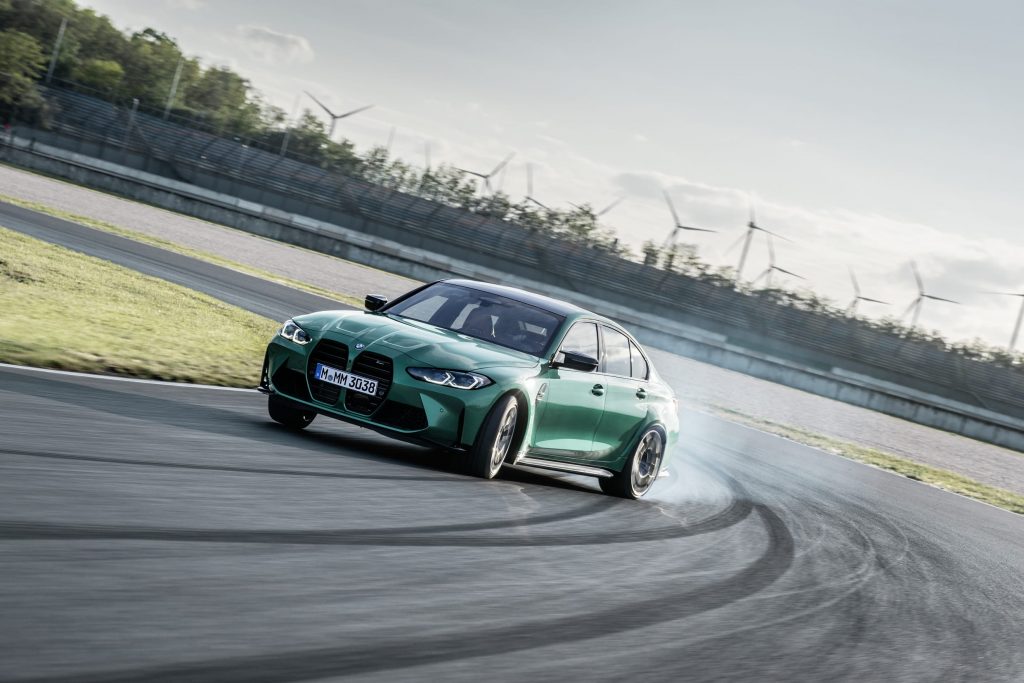 Green 2021 BMW M3 On track drift