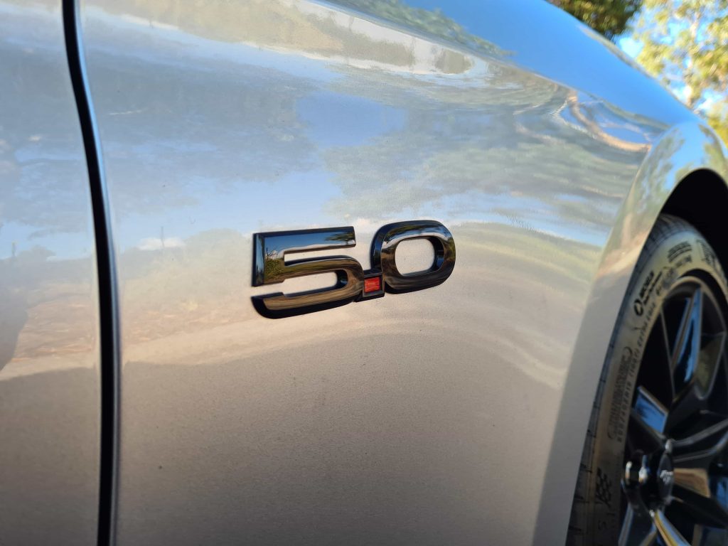 Silver Ford Mustang V8 Badge