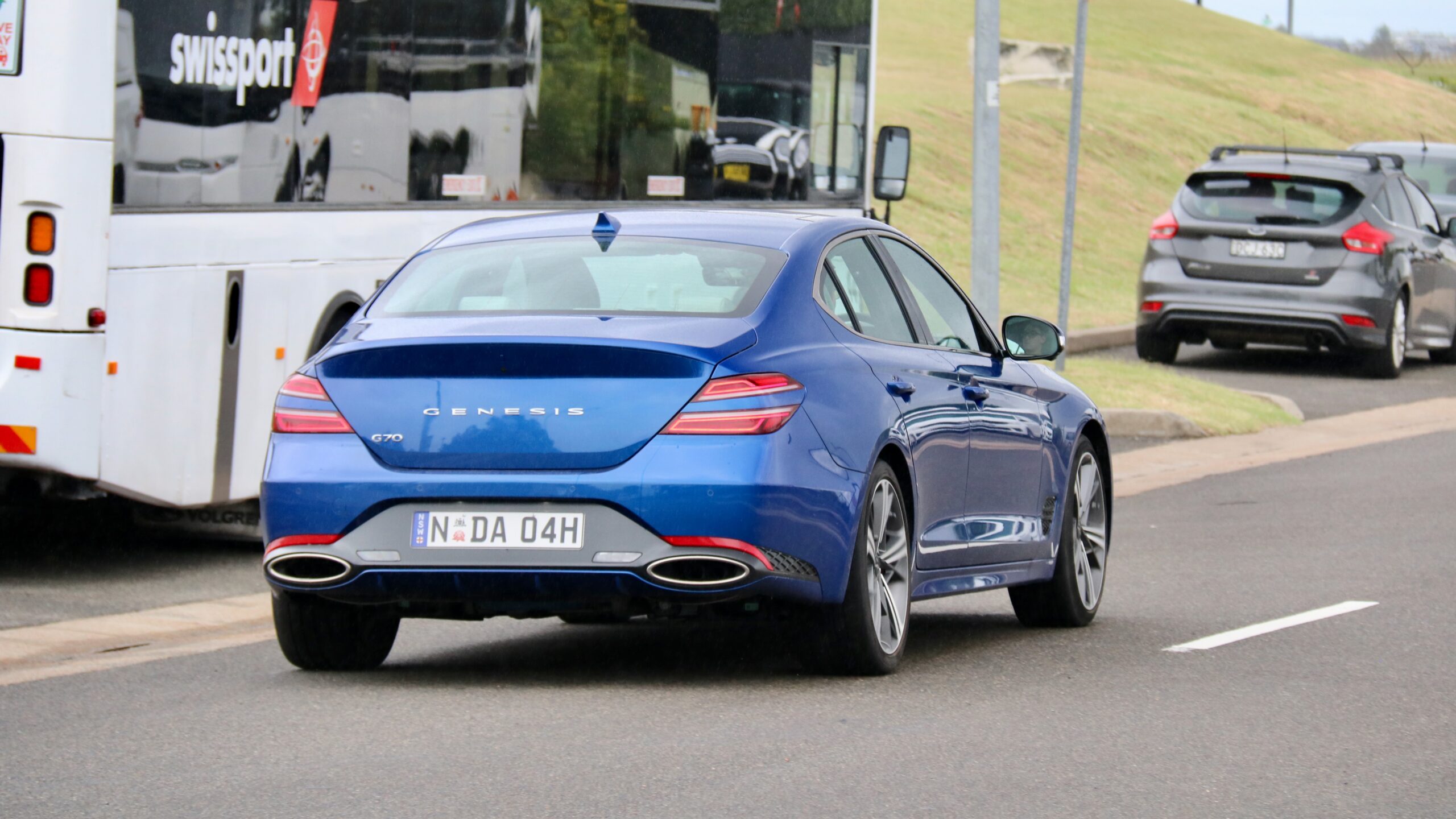 2024 Genesis G70 Sedan rear driving